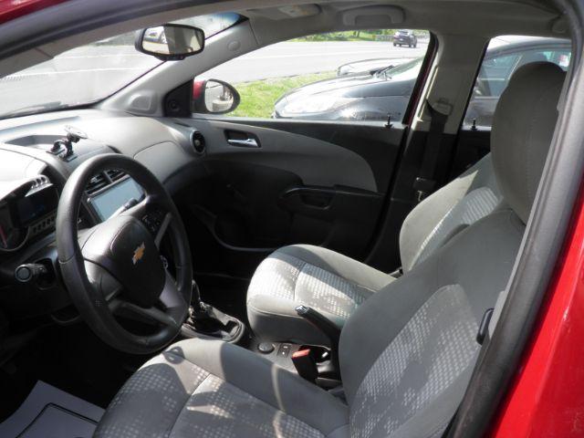 2014 RED Chevrolet Sonic LS Manual Sedan (1G1JB5SH5E4) with an 1.8l L4 engine, 5SP transmission, located at 19521 New George's Creek Rd SW, Barton, MD, 21521, (301) 463-2404, 39.524323, -79.017906 - Photo#1
