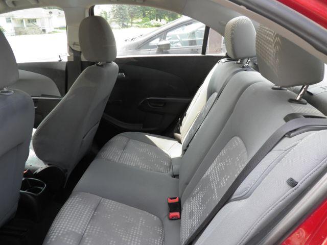 2014 RED Chevrolet Sonic LS Manual Sedan (1G1JB5SH5E4) with an 1.8l L4 engine, 5SP transmission, located at 19521 New George's Creek Rd SW, Barton, MD, 21521, (301) 463-2404, 39.524323, -79.017906 - Photo#3