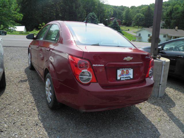 2014 RED Chevrolet Sonic LS Manual Sedan (1G1JB5SH5E4) with an 1.8l L4 engine, 5SP transmission, located at 19521 New George's Creek Rd SW, Barton, MD, 21521, (301) 463-2404, 39.524323, -79.017906 - Photo#4