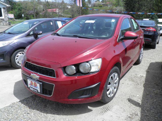 2014 RED Chevrolet Sonic LS Manual Sedan (1G1JB5SH5E4) with an 1.8l L4 engine, 5SP transmission, located at 19521 New George's Creek Rd SW, Barton, MD, 21521, (301) 463-2404, 39.524323, -79.017906 - Photo #0