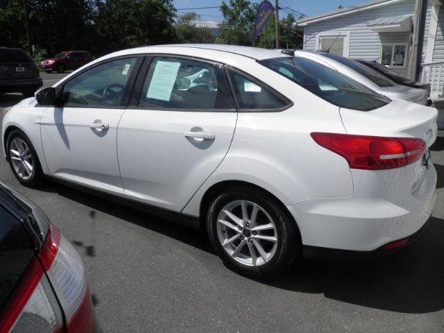 2017 White Ford Focus SE Sedan (1FADP3F25HL) with an 2.4L I4 engine, AT transmission, located at 15520 McMullen Hwy SW, Belair, MD, 21502, (301) 729-3700, 39.581375, -78.846451 - Photo#4
