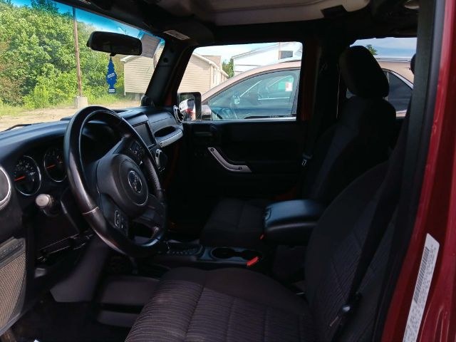 2011 RED Jeep Wrangler Unlimited Rubicon 4W (1J4HA6H11BL) with an 3.8 V6 engine, located at 19521 New George's Creek Rd SW, Barton, MD, 21521, (301) 463-2404, 39.524323, -79.017906 - Photo#1