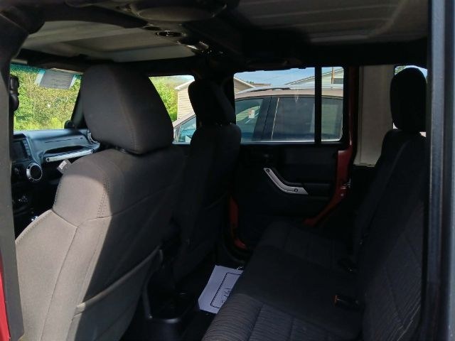 2011 RED Jeep Wrangler Unlimited Rubicon 4W (1J4HA6H11BL) with an 3.8 V6 engine, located at 19521 New George's Creek Rd SW, Barton, MD, 21521, (301) 463-2404, 39.524323, -79.017906 - Photo#2