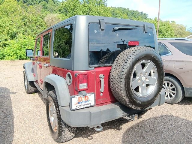 2011 RED Jeep Wrangler Unlimited Rubicon 4W (1J4HA6H11BL) with an 3.8 V6 engine, located at 19521 New George's Creek Rd SW, Barton, MD, 21521, (301) 463-2404, 39.524323, -79.017906 - Photo#3