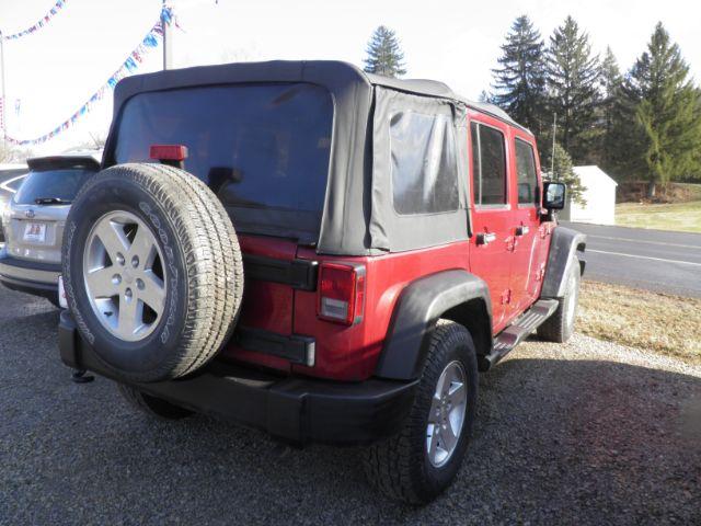 2012 RED Jeep Wrangler Unlimited Sport 4WD (1C4BJWDG6CL) with an 3.6L V6 engine, 6SP transmission, located at 19521 New George's Creek Rd SW, Barton, MD, 21521, (301) 463-2404, 39.524323, -79.017906 - Photo#4