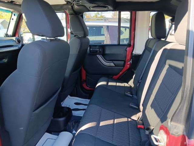 2012 RED Jeep Wrangler Unlimited Sport 4WD (1C4BJWDG6CL) with an 3.6L V6 engine, 6SP transmission, located at 15520 McMullen Hwy SW, Belair, MD, 21502, (301) 729-3700, 39.581375, -78.846451 - Photo#2