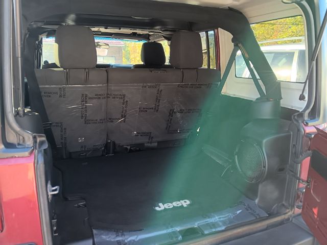 2012 RED Jeep Wrangler Unlimited Sport 4WD (1C4BJWDG6CL) with an 3.6L V6 engine, 6SP transmission, located at 15520 McMullen Hwy SW, Belair, MD, 21502, (301) 729-3700, 39.581375, -78.846451 - Photo#3