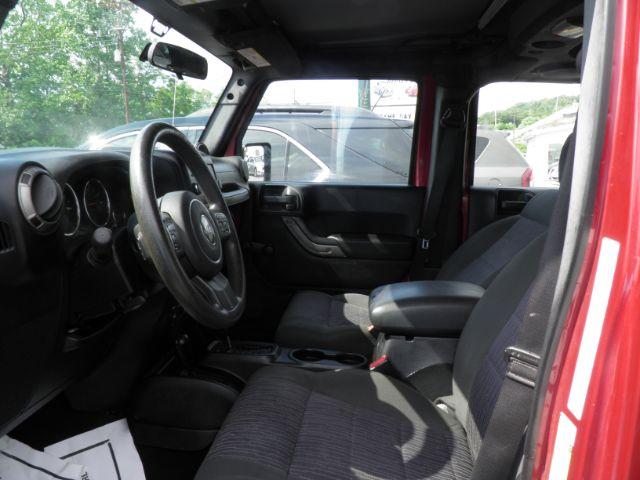 2011 RED Jeep Wrangler Unlimited Sport 4WD (1J4BA3H11BL) with an 3.8 V6 engine, AT transmission, located at 15520 McMullen Hwy SW, Belair, MD, 21502, (301) 729-3700, 39.581375, -78.846451 - Photo#1