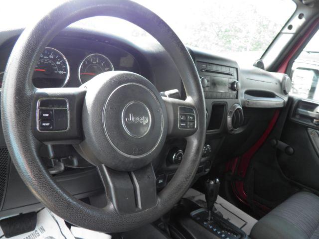 2011 RED Jeep Wrangler Unlimited Sport 4WD (1J4BA3H11BL) with an 3.8 V6 engine, AT transmission, located at 15520 McMullen Hwy SW, Belair, MD, 21502, (301) 729-3700, 39.581375, -78.846451 - Photo#2