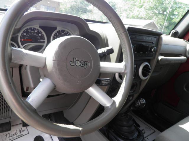 2010 Red Jeep Wrangler Unlimited Sahara 4WD (1J4BA5H13AL) with an 3.8L V6 engine, MAN transmission, located at 19521 New George's Creek Rd SW, Barton, MD, 21521, (301) 463-2404, 39.524323, -79.017906 - Photo#2