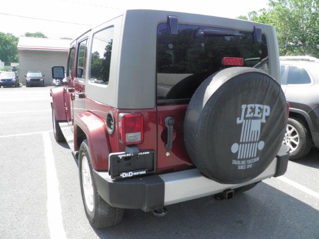 2010 Red Jeep Wrangler Unlimited Sahara 4WD (1J4BA5H13AL) with an 3.8L V6 engine, MAN transmission, located at 19521 New George's Creek Rd SW, Barton, MD, 21521, (301) 463-2404, 39.524323, -79.017906 - Photo#5