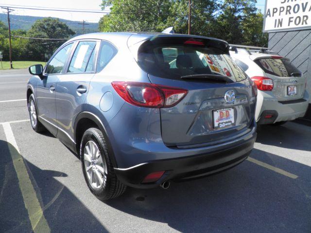2016 Blue Mazda CX-5 Sport (JM3KE4BY5G0) with an 2.5L I4 engine, AT transmission, located at 15520 McMullen Hwy SW, Belair, MD, 21502, (301) 729-3700, 39.581375, -78.846451 - Photo#5