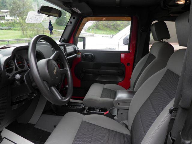 2010 RED Jeep Wrangler Sport (1J4AA2D17AL) with an 3.8 V6 engine, located at 19521 New George's Creek Rd SW, Barton, MD, 21521, (301) 463-2404, 39.524323, -79.017906 - Photo#1