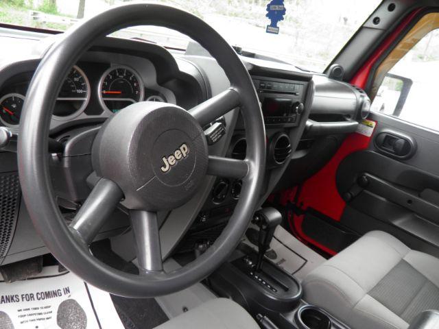 2010 RED Jeep Wrangler Sport (1J4AA2D17AL) with an 3.8 V6 engine, located at 19521 New George's Creek Rd SW, Barton, MD, 21521, (301) 463-2404, 39.524323, -79.017906 - Photo#2